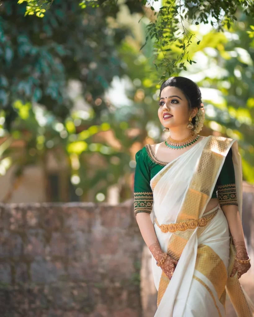 Women in Kerala saree and jhumka earrings