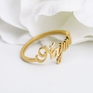 gold wedding ring with the name