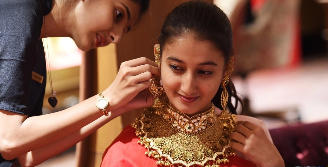 Woman guiding how to wear jewellery