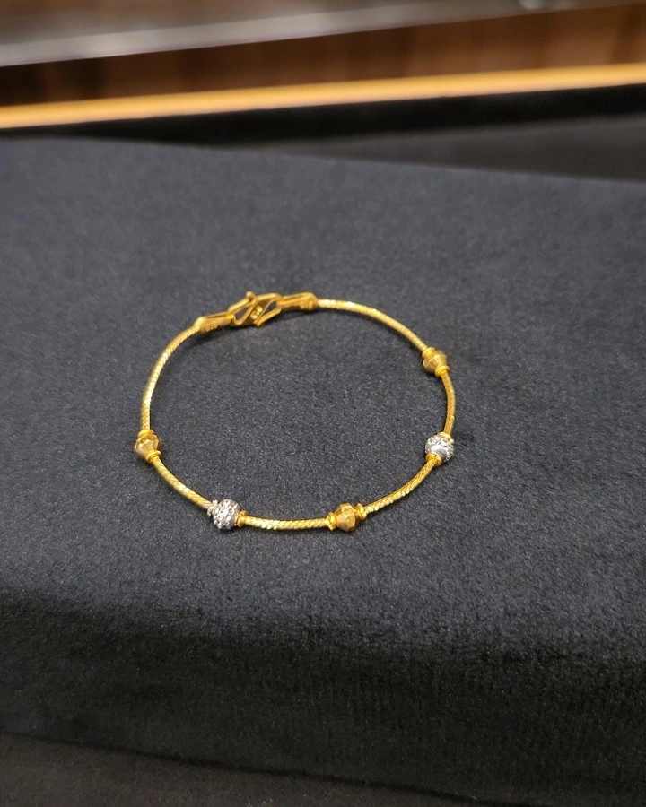 Gold Bangle with a mix of rhodium beads